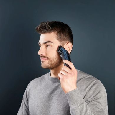 Rowenta Машинка для стрижки Barber Experience, сеть+акум., роторный мотор DC, насадок-12, кейс, нерж. сталь, синий TN1551E0 фото