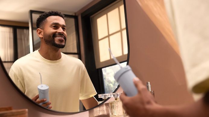 Philips Іригатор Philips портативний Sonicare Compact Flosser 1000, чаша 200 мл, складний, голубий HX3333/24 фото