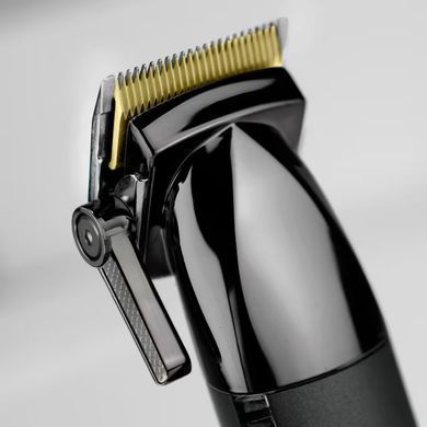 BaByliss Машинка для стрижки Super-X Metal Series, акум., насадок-12, быстрая заряд, сумка для хранения, сталь с графитовим покрытием, чорно-серебр. E991E фото