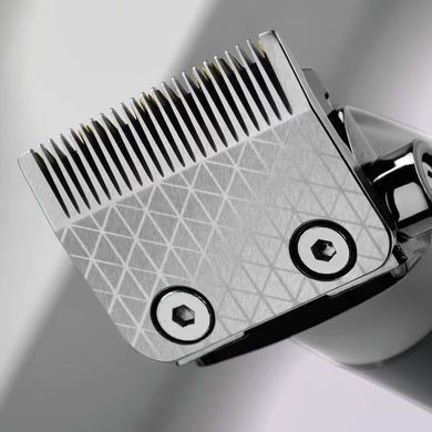 BaByliss Машинка для стрижки Super-X Metal Series, акум., насадок-12, быстрая заряд, сумка для хранения, сталь с графитовим покрытием, чорно-серебр. E991E фото